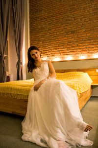 silk wedding dress, brickwall