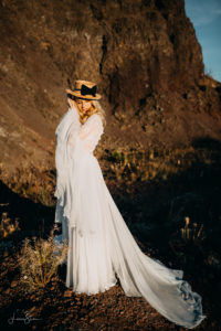 bride posing in nature in the sweet light of the golden hour