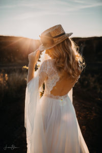 bride posing in nature in the sweet light of the golden hour
